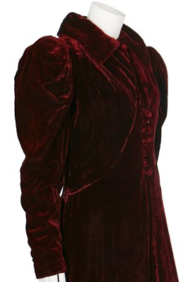 Lot 43 - A bordeaux velvet evening coat with leg-o-mutton sleeves, 1930s