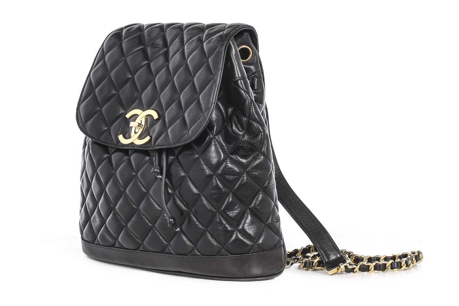 Lot 2 - A Chanel quilted black leather backpack, circa...