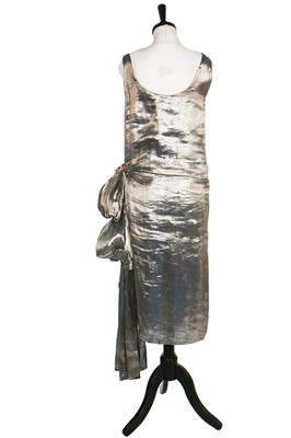 Lot 7 - A blue lamé dress with draped swags and cascading iridescent-pink petals to hip, 1920s