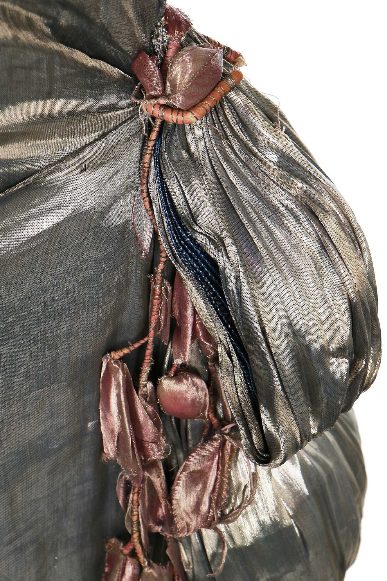 Lot 7 A blue lamé dress with draped swags and