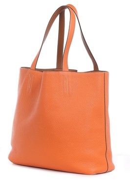Lot 3 - An Hermès Double Sens clemence leather tote...