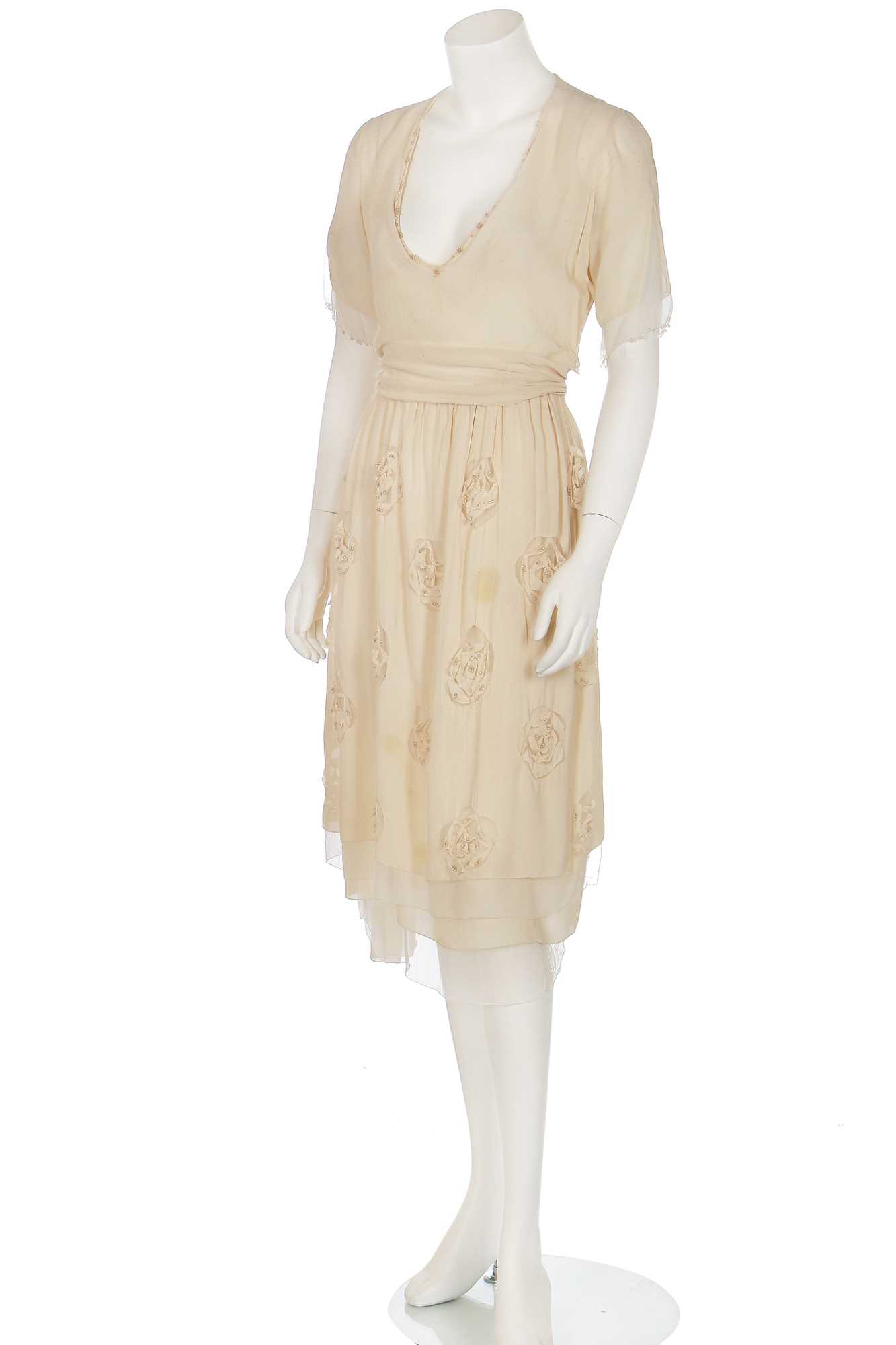 Lot 75 - A cutwork ivory chiffon dress, attributed to Chanel, 1919