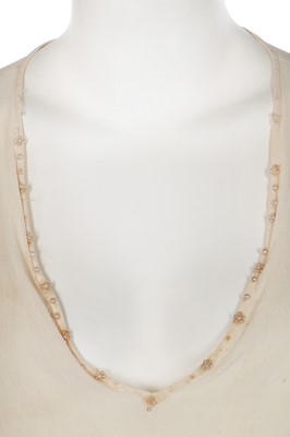 Lot 75 - A cutwork ivory chiffon dress, attributed to Chanel, 1919