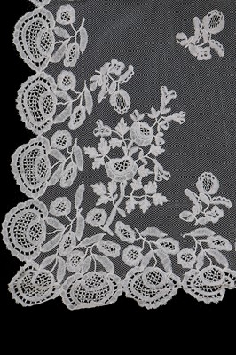 Lot 384 - A Honiton appliqué lace veil, 1830s and later remounted
