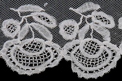 Lot 384 - A Honiton appliqué lace veil, 1830s and later remounted
