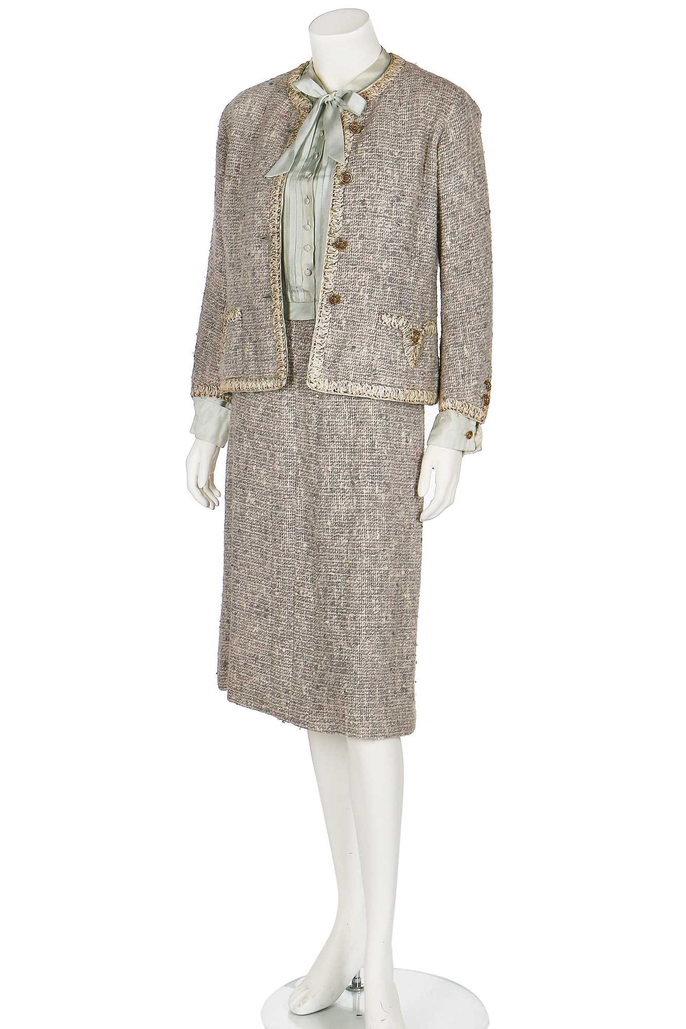 Lot 17 - A Chanel couture grey-pink tweed suit, 1960