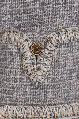 Lot 17 - A Chanel couture grey-pink tweed suit, 1960
