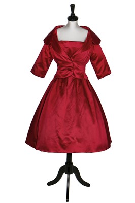 Lot 106 - A Christian Dior raspberry-pink satin cocktail dress with matching bolero, late 1950s