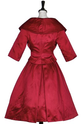 Lot 106 - A Christian Dior raspberry-pink satin cocktail dress with matching bolero, late 1950s