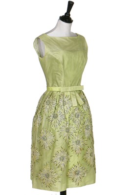 Lot 108 - A Norman Hartnell couture pale green sequinned tulle cocktail dress, circa 1960