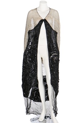 Lot 32 - A kimono-style coat of Poiret-inspired printed silk, edged in black fur, circa 1918