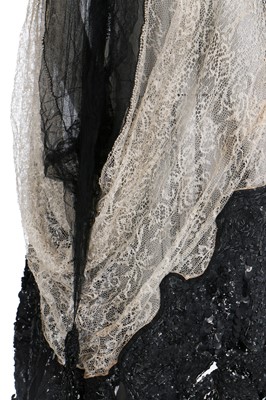 Lot 32 - A kimono-style coat of Poiret-inspired printed silk, edged in black fur, circa 1918