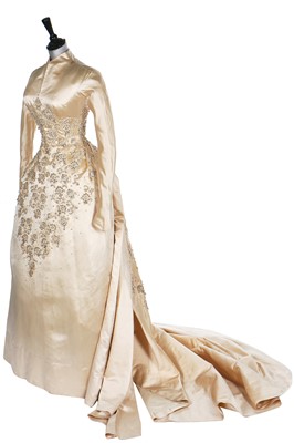 Lot 97 - A good Norman Hartnell couture satin bridal gown, circa 1953