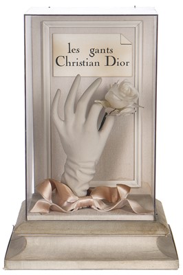 Lot 107 - A Christian Dior shop display of a mounted and encased gloved hand holding a rose, 1950s