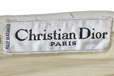 Lot 146 - A Christian Dior by Marc Bohan couture ivory silk crêpe evening gown, circa 1968