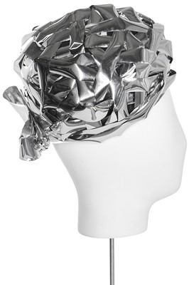 Lot 143 - A futuristic Dior hat of woven silver cellophane-ribbon over a tulle ground, circa 1965