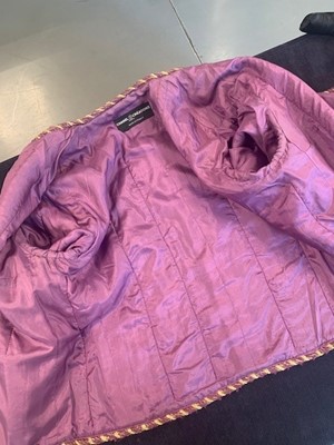Lot 214 - A Chanel mauve bouclé wool suit, 1990s