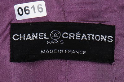 Lot 214 - A Chanel mauve bouclé wool suit, 1990s