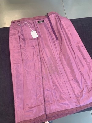 Lot 214 - A Chanel mauve bouclé wool suit, 1990s