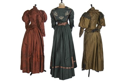 Lot 15 - Three silk gowns in shades of green and brown, 1890s-1910s