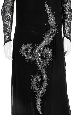 Lot 61 - A black chiffon cocktail dress, early 1930s