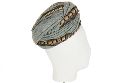 Lot 86 - A Dior turban of wrapped grey-blue knitted jersey, 1950s