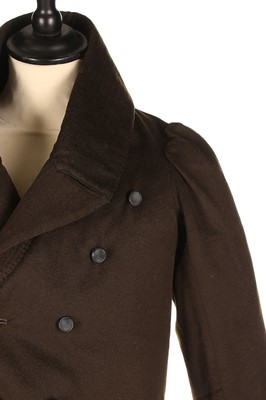 Lot 84 - A rare young man's brown wool tailcoat, 1820s,...