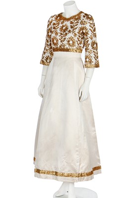 Lot 408 - A Pierre Balmain couture ivory satin evening gown, circa 1968