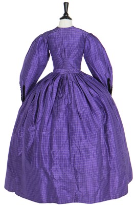 Lot 4 - A gown of violet Mauveine taffeta, 1850s