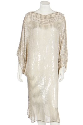 Lot 432 - A Pierre Cardin beaded and sequinned ivory chiffon cocktail dress, 1980s