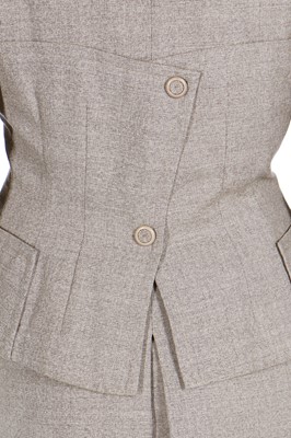 Lot 84 - A Schiaparelli flecked beige wool suit, circa 1950