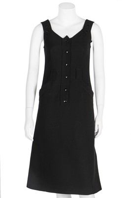 Lot 145 - A Courrèges black wool pinafore dress, French, circa 1970
