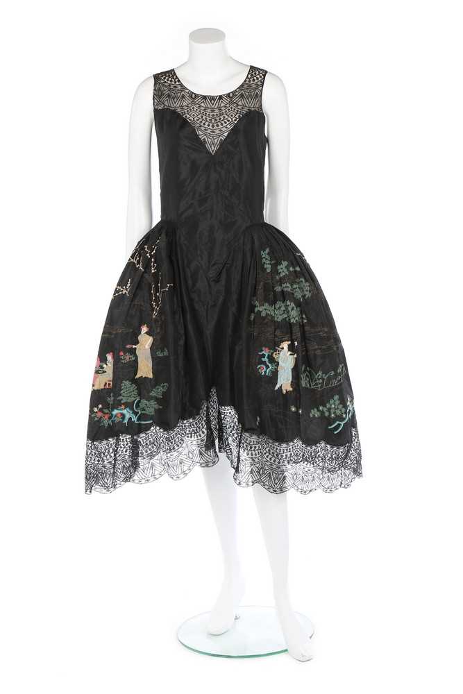 Lot 107 - A Chinoiserie embroidered black taffeta robe...