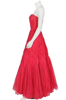 Lot 94 - A raspberry-pink pleated chiffon evening gown in the style of Jean Dessès, circa 1959