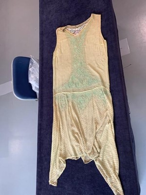 Lot 48 - A beaded pale yellow muslin flapper dress, circa 1925