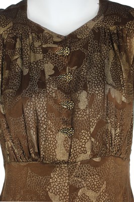 Lot 70 - Two good lamé evening gowns in shades of gold and brown, 1930s