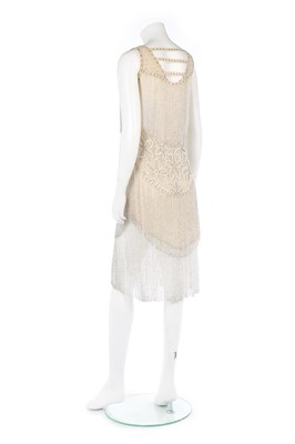 Lot 114 - A couture ivory chiffon beaded flapper dress,...