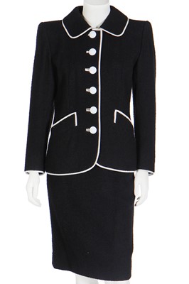 Lot 173 - An Yves Saint Laurent couture black bouclé wool suit, circa 1988