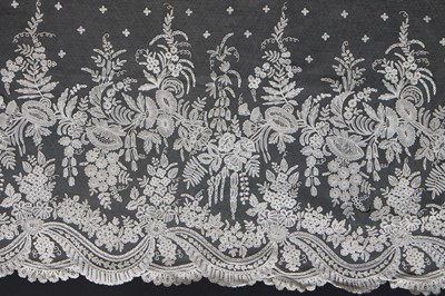 Lot 274 - A good dress flounce of Brussels bobbin applique, circa 1860