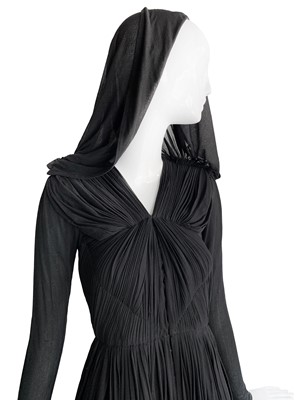 Lot 374 - A fine Madame Grès couture black silk jersey cocktail dress with draped hood, circa 1942