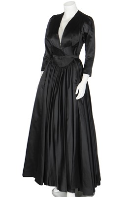 Lot 383 - A Nina Ricci couture black satin evening gown, early 1950s