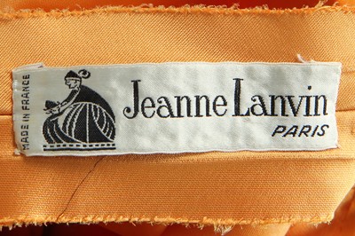 Lot 401 - Maison Lanvin couture by Jules-François Crahay - an apricot ziberline evening gown, circa 1968