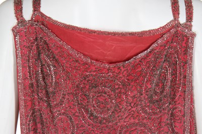 Lot 52 - A coral-pink silk beaded flapper dress, late 1920s