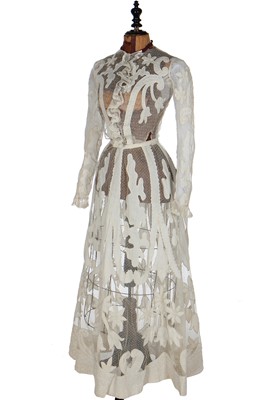 Lot 19 - A floral printed blue and white striped cotton gown, circa 1905