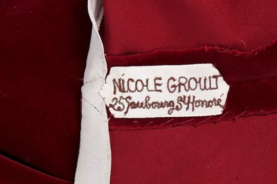 Lot 126 - A Nicole Groult couture bias-cut red velvet...