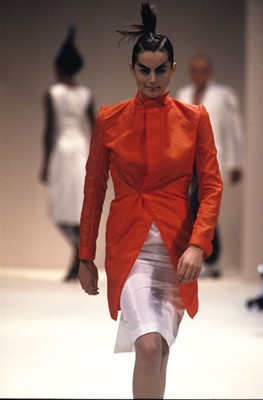 Lot 461 - A rare Alexander McQueen bright orange nylon coat, 'The Hunger' collection, Spring-Summer 1996