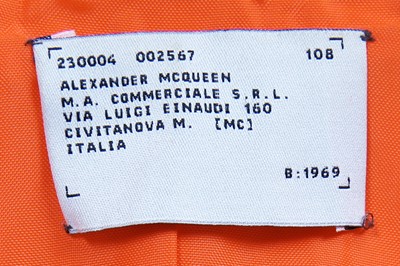 Lot 461 - A rare Alexander McQueen bright orange nylon coat, 'The Hunger' collection, Spring-Summer 1996