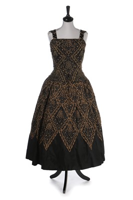 Lot 379 - A Dior London embellished black faille cocktail dress, model 'Mexico', Autumn-Winter 1954-55