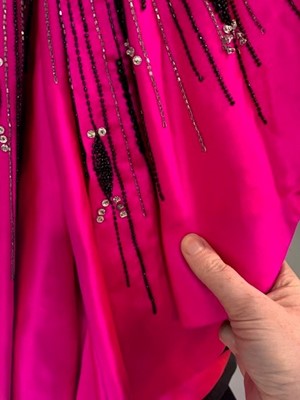 Lot 179 - A bespoke Darnell shocking-pink and black satin evening gown, 1983