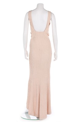 Lot 133 - A Lucien Lelong cloque pink crêpe evening gown,...